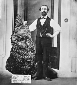 Bernhardt Holtermann posing with the Holtermann Nugget, one of the largest gold nuggets ever found weighing in at 630 pounds, Sydney, c. 1875.