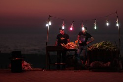 unearthedviews:  Gaza City, Gaza: Palestinian men sell corn on the cob at a beach stallMahmud Hams/AFP/Getty Images