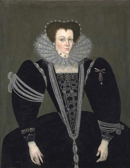 Portrait of a lady, three-quarter-length, in a black dress embellished with jewels and pearls, a lac