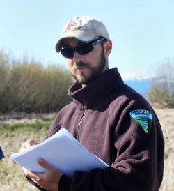 BLM fisheries biologist, Robert Roninger, explains the process of collecting data on the Oregon spotted frog (OSF) to a group of BLM and US Fish and Game employees.