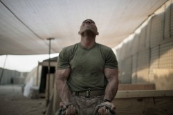 house-of-gnar:  US Marine training at an outdoor gym in Afghanistan.