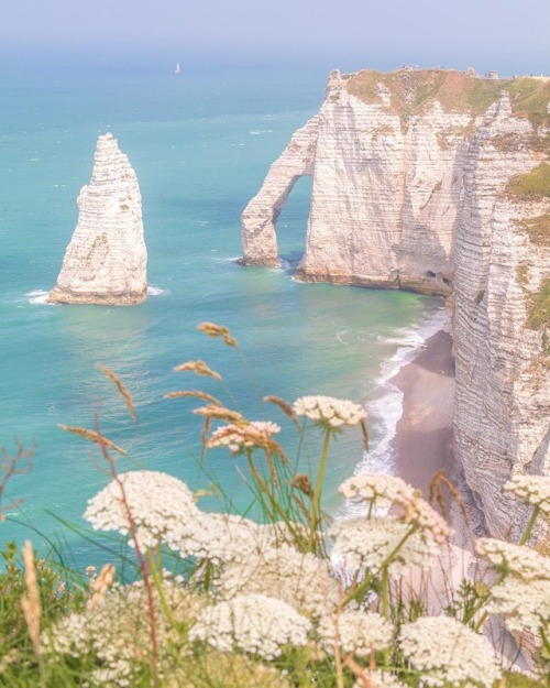 The mythical white chalk cliffs and its gray pebble beaches of Étretat, located in the Seine-Maritim