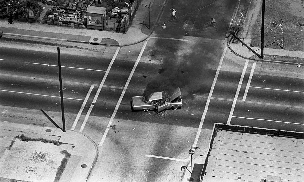 furtho:   Car burning at the intersection of Avalon Blvd during the Watts Riots,