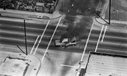 furtho: Car burning at the intersection of Avalon Blvd during the Watts Riots, Los Angeles, 1965 (via here)