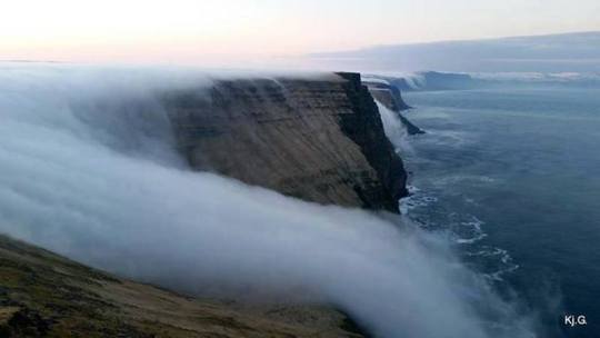 Captured overlooking the cliffs in Látrabjarg, this fog waterfall in Iceland is pretty spectacular, but unfortunately not...