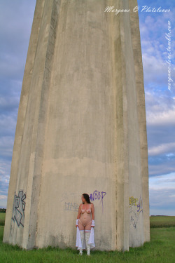 morgane-love:  Flashing in public near a water tower next to a road. Je m’exhibe près d’un château d’eau au bord d’une route. 