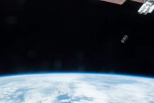 Miniature “Cubesat” satellites being launched from the International Space Station.Photo credit: NAS