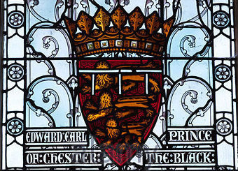 Stained glass window with the names and heraldic arms of Edward of Woodstock, earl of Chester (The B