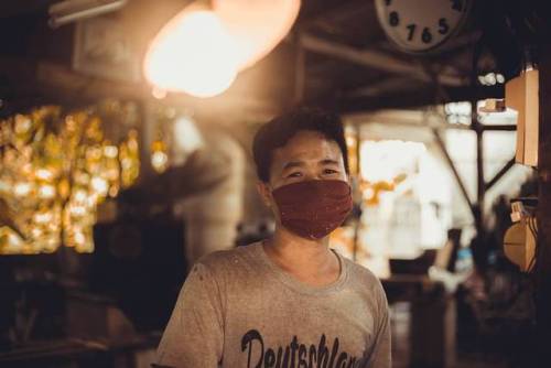 A portrait of a worker from Koh Samui, Thailand who works in a factory where they craft coconut shel