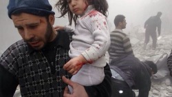 freesyria:  A Syrian man evacuates a child found in the rubble of a building reportedly hit by an explosives-filled barrel dropped by a government forces helicopter. 