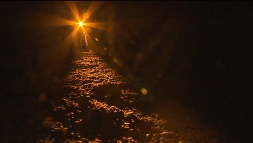 Winter light filters through the 5000 year old passage tomb at Newgrange in the Boyne Valley, Irelan