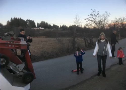 Shakira, Milan, and Sasha helping someone pull their car out of a ditch a few days ago