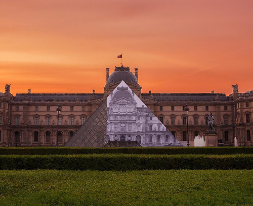 gravityhome:  Optical illusion at the Louvre in Paris. Artist JR covered the glass pyramid with a black and white image of the historic palace building. The second picture (by David Emeran) was taken when the project was still unfinished to let you see