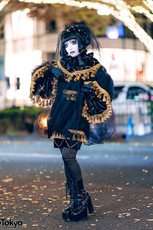 Japanese shironuri artist Minori on the street in Harajuku wearing hand painted shironuri makeup, ha