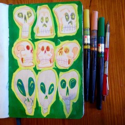 Adding color to previously doodled skulls.
