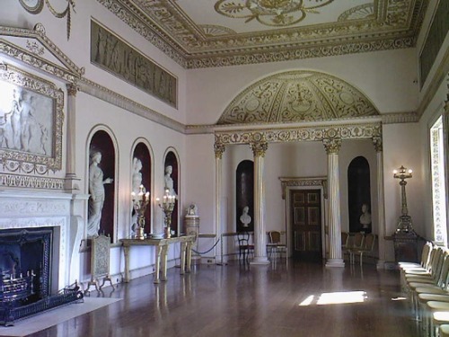 The dining room at Syon House, England, designed by Robert Adam in 1763.The niches facing the window