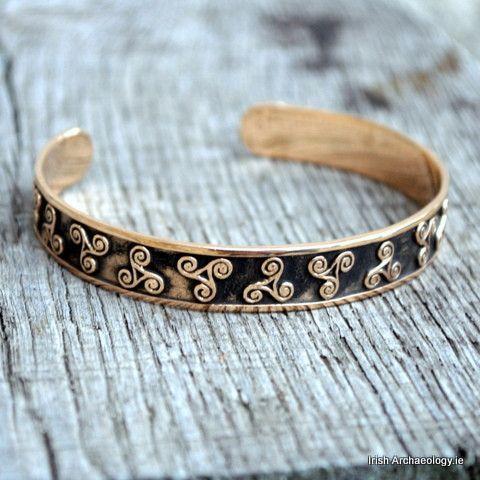 Fashioned out of bronze, this Celtic bracelet is decorated with triskele motifs which are inspired b