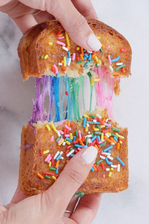 DIY Rainbow Grilled CheeseMake this Rainbow Grilled Cheese by using food coloring to tint the cheese