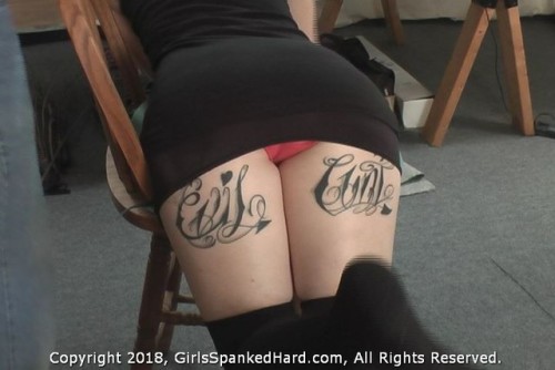 girlsspankedhard: Feb 2018 - Mimi leans over a chair and gets spanked over her cute black skirt with