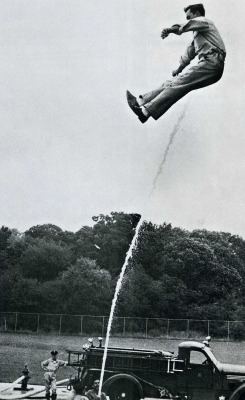 Fireman Donald MacDanel practices getting up on burning roofs without a hook-and-ladder, Washington D.C.