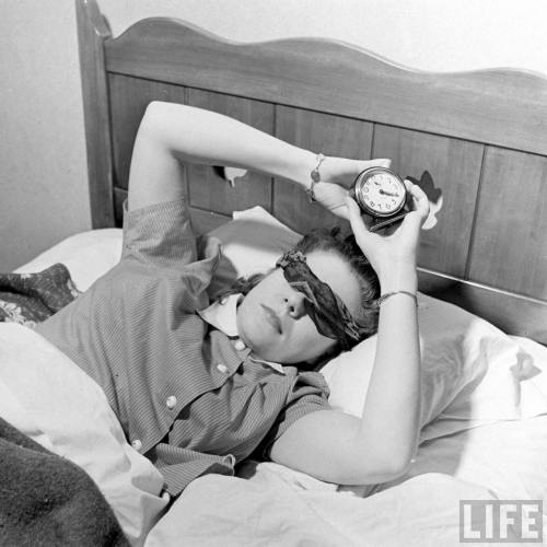 Jean Ruth demonstrates  turning off the alarm while blindfolded.(Ralph Morse. 1942)