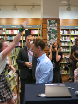 kittykate90:  I present to you Tom Hiddleston, flower-crowned king of everything :D (Kinokuniya Bookstore, Sydney 9/10/2013) 