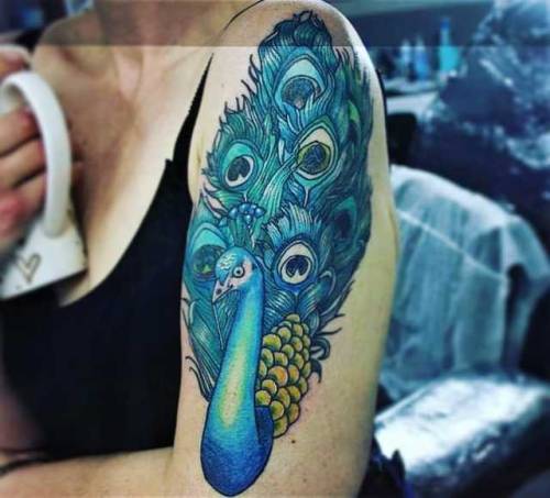 About 3-4 weeks healed. #peacocktattoo #peacock #feathers #feathertattoo #feather #tatouinti #blue #