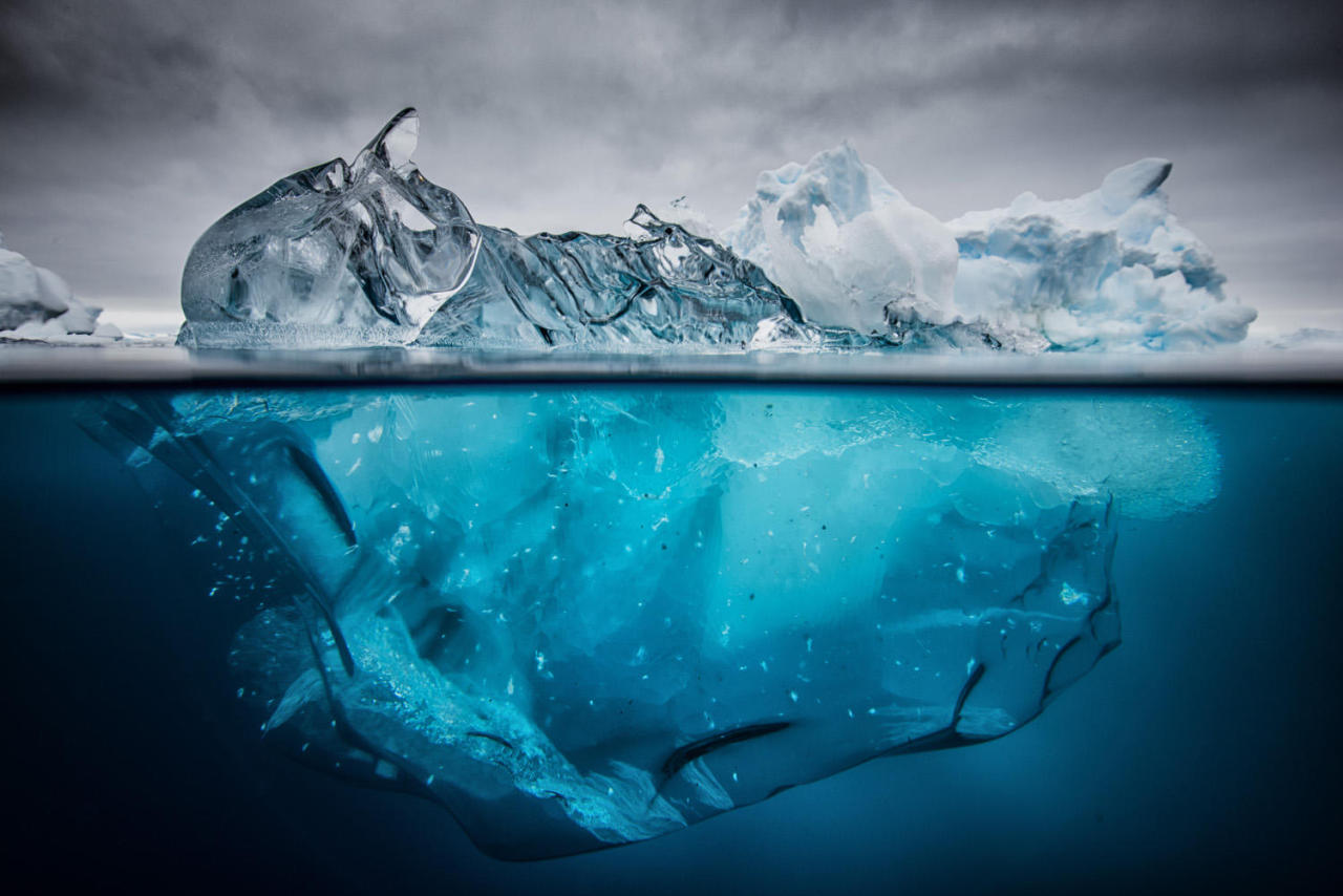 nubbsgalore:  the submerged underside of an iceberg becomes revealed when it flips,