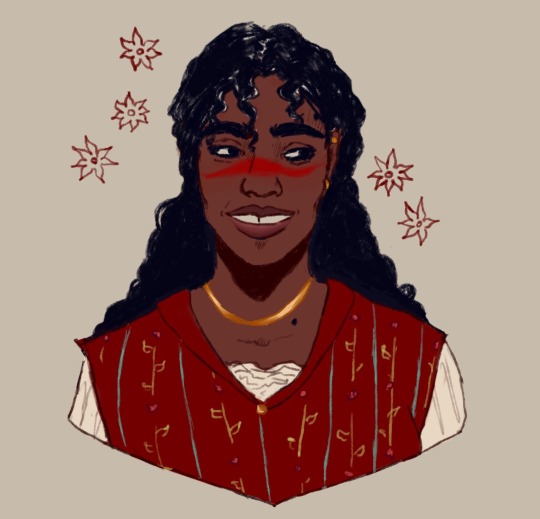 A Latina Hawke with dark brown skin. long curly black hair, gap-toothed smile, full lips & wide nose wearing a red embroidered tunic over a white blouse, gold jewelry, & smiling. 