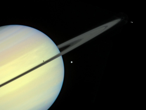 humanoidhistory:The planet Saturn and moons, observed by the Hubble Space Telescope in 1995.(HubbleS