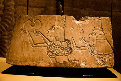 A limestone relief block depicts Ay and his wife Tey receiving the gold of honor, relief from Tey&rs