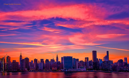  Wispy pink &amp; orange sunset skies tonight in NYC.  One shutterbug&rsquo;s