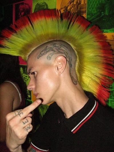 punkerskinhead:  hot looking punk with piercings and bright colored mohawk 