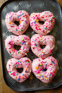 sallysbakingaddiction:  Party perfect heart shaped donuts! Overloaded with sprinkles, of course. Click here for the recipe.