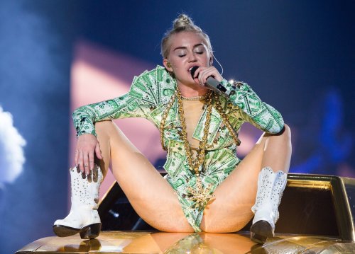 pornwhoresandcelebsluts:  Miley Cyrus spread eagle.. fingering herself and showing off her crotch to her adoring teenage fans live in concert
