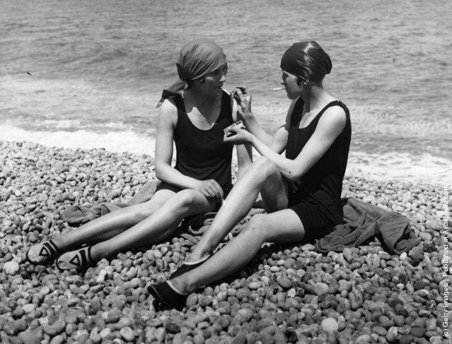  Two bathers enjoy a cigarette on the beach at Lowestoft, 1926. Here, a look back