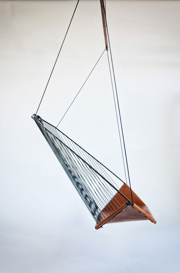 worclip:  Hanging Chair by Félix Guyon Materials: steel, leather  This chair is