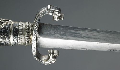 art-of-swords:  Short Sword with Scabbard Dated: circa 1753 Maker: unknown Place of Origin: Southeastern Europe Medium: steel, wood and silver niello work Measurements: blade length: 53.9 cm  Source: Copyright © 2014 The Wallace Collection  