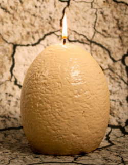 sixpenceee:  Dinosaur Egg CandleThis egg candle hatches a baby raptor when it melts. The Hatching Dinosaur Candle is available for preorder and will be delivered in 2016. Its dimensions are approximately 14cm(W) x 14cm(H) x 15.8cm(D). (Source)