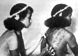 Papua New Guinean   women tattooing. Via collection
