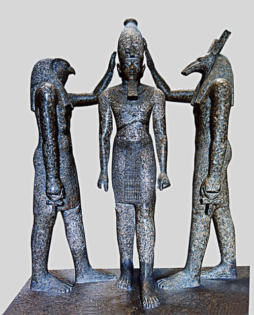 Statue of Ramesses III with Horus and SethThe group represents King Ramesses III, the god Horus and 