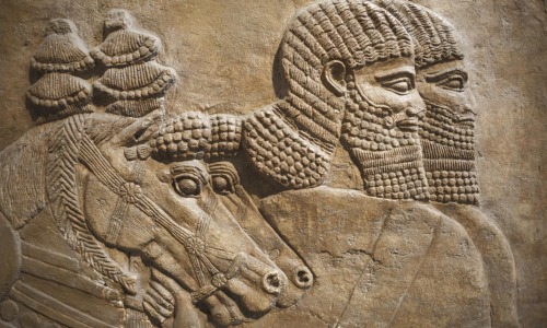 Detail of an Assyrian relief from Nimrud, Iraq, showing horses and horsemen of the royal chariot, 72