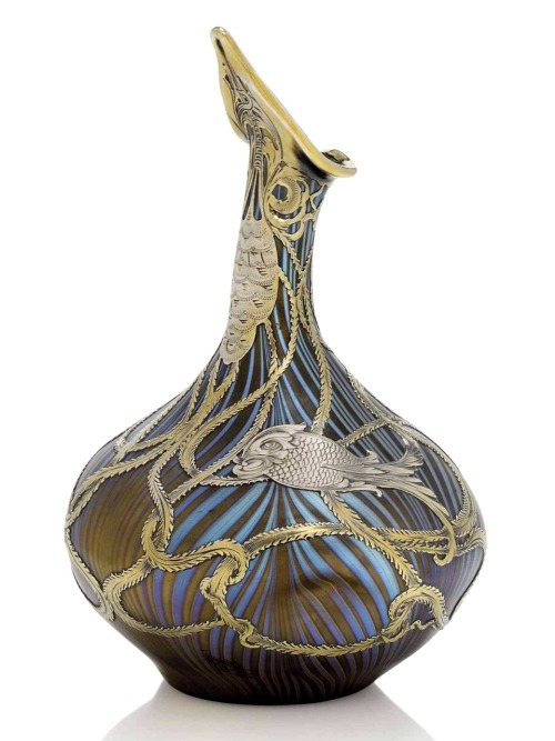 A Loetz Iridescent Glass ‘Rose Sprinkler’ Shaped Vase with Silver Applique.c.1900.The pale yellow gl