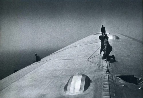 Maintenance workers conducting repairs on the Graf Zeppelin in mid-air over the South Atlantic after it was damaged during a storm, by Alfred Eisenstaedt, 1934 [1600x1092] Check this blog!