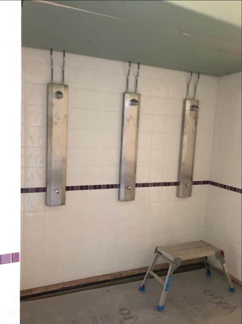 Newly renovated boy’s showers at Worthing High School, Worthing, UK. Nice to see no stalls.