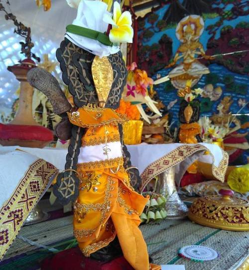 Pratima (deity icon) made from coins and gold face, Bali