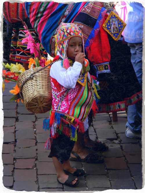 Young child dressed in traditional Peruvian costume, Corpus Christi procession