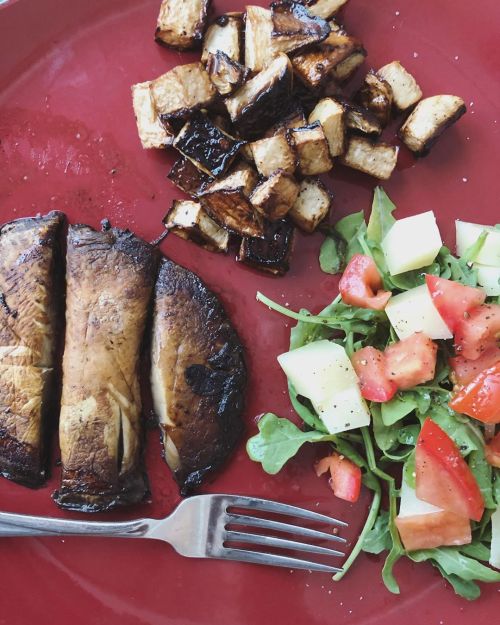 Portobello mushrooms, with roasted, balsamic turnips and a fresh arugula salad topped with truffle o