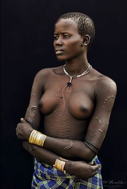 Iseo58:  Young Girl From The Bodi Tribe. Omo Valley, Ethiopia, ©Pit Buehler 