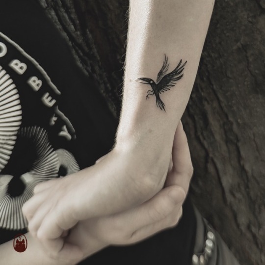 Small color raven tattoo by Blaze Schwaller TattooNOW